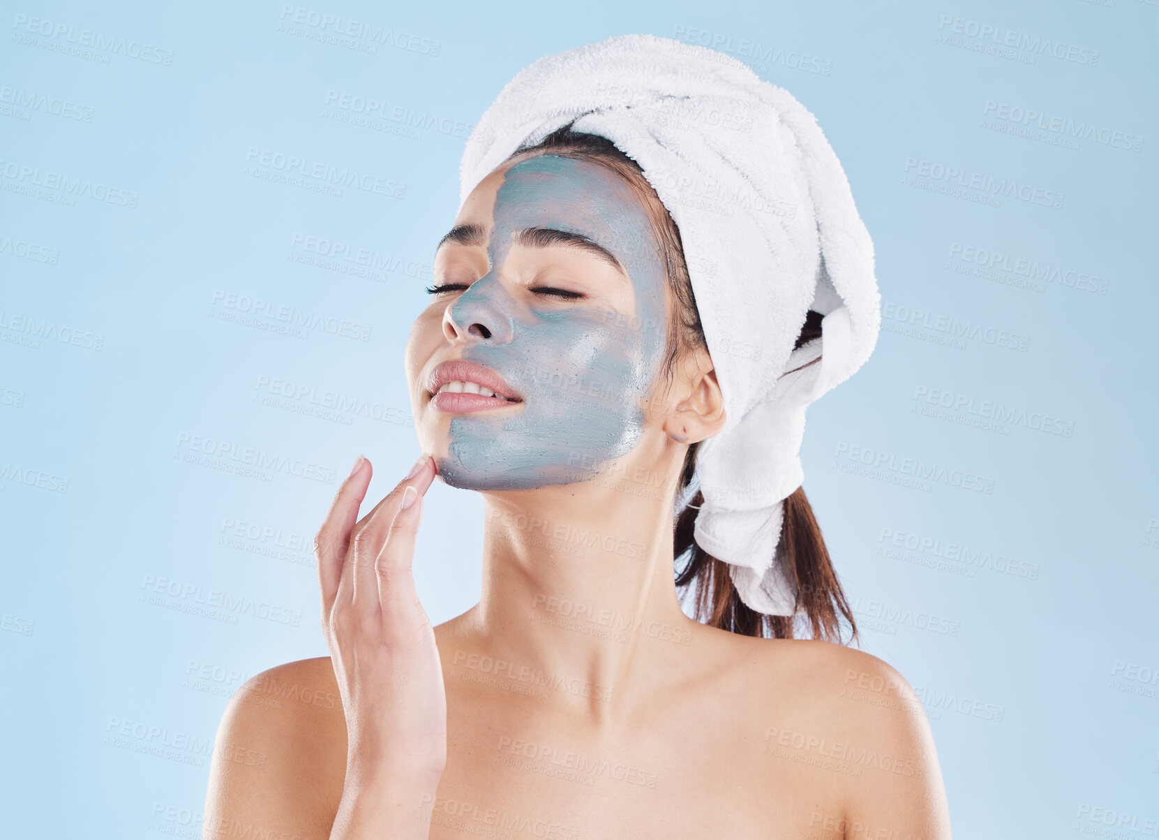 Buy stock photo Charcoal face mask for skincare, cosmetic beauty for health skin and woman care for body against blue mockup studio background. Healthy, young and calm model doing self care with wellness product