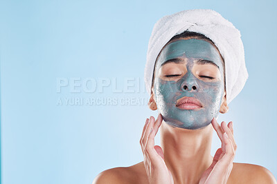 Buy stock photo Facial, skincare and woman with face mask cream for beauty, health and wellness in studio with blue background. Cosmetics, product and young girl at luxury spa for acne treatment in a model portrait