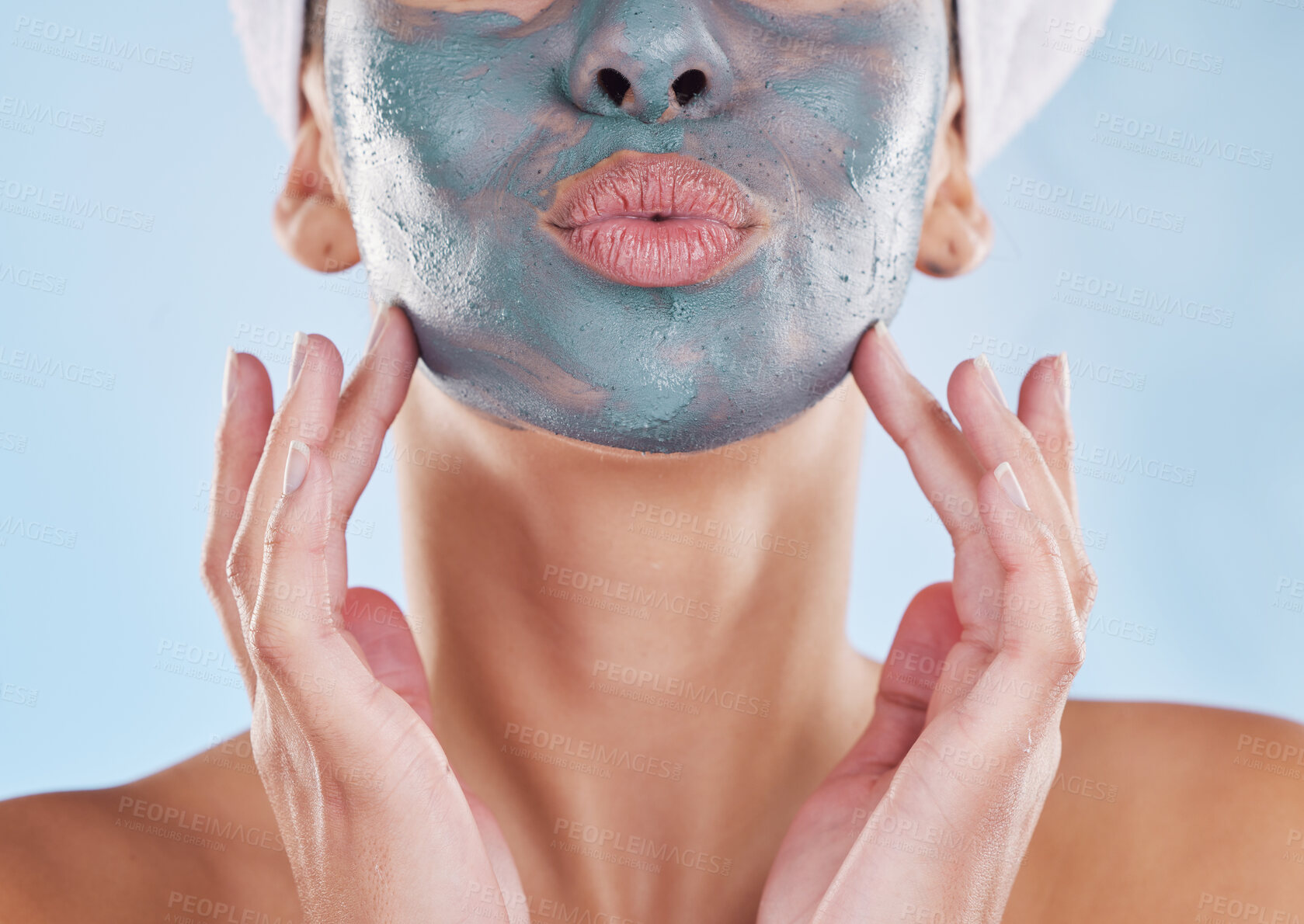 Buy stock photo Skincare wellness, charcoal face mask and beauty product for healthy skin against blue mockup studio background. Model pouting mouth, care for body and natural cosmetic treatment for wellbeing