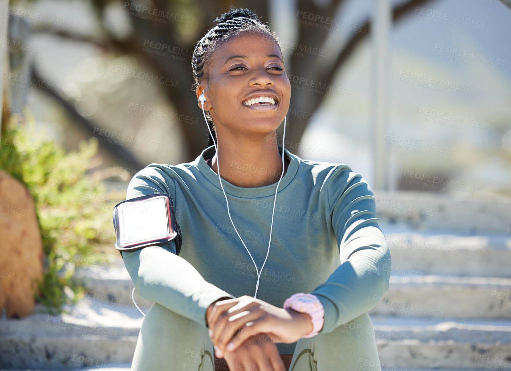 Buy stock photo Smile, fitness and black woman with on steps, music and relax with earphones, exercise and workout goal. Female person, girl and athlete listening to sound, audio and calm outdoor, sports or wellness