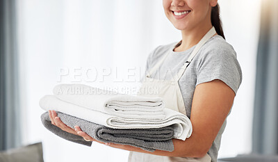 Buy stock photo Towel, cleaner and hands of woman with pile of clean laundry, washing linen or hotel room service. Person, maid or routine cleaning of a fresh stack of towels, washed fabric or mockup space at home