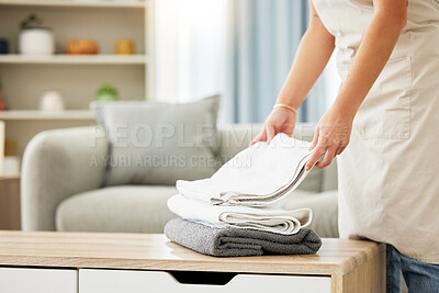Buy stock photo Cleaner, towel and woman hands with a pile of clean laundry, washing linen or hotel room service. Person, maid and routine cleaning of a fresh stack of towels or washed clothing for home bathroom