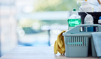Buy stock photo Basket, table and product for cleaning with space, cloth and chemical for mockup by blurred background in home. House, mock up and plastic container for services, stop bacteria and dust in interior