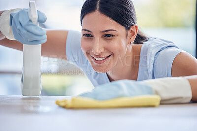 Buy stock photo Happy woman, housekeeper and detergent for cleaning table, hygiene or bacteria and germ removal at home. Female person, cleaner or maid spraying or wiping furniture or surface for dust, dirt or stain
