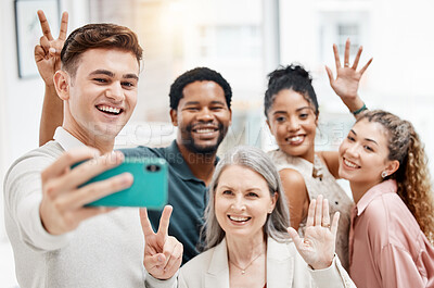Buy stock photo Group of cheerful diverse businesspeople taking a selfie together at work. Happy caucasian businessman taking a photo with his content colleagues