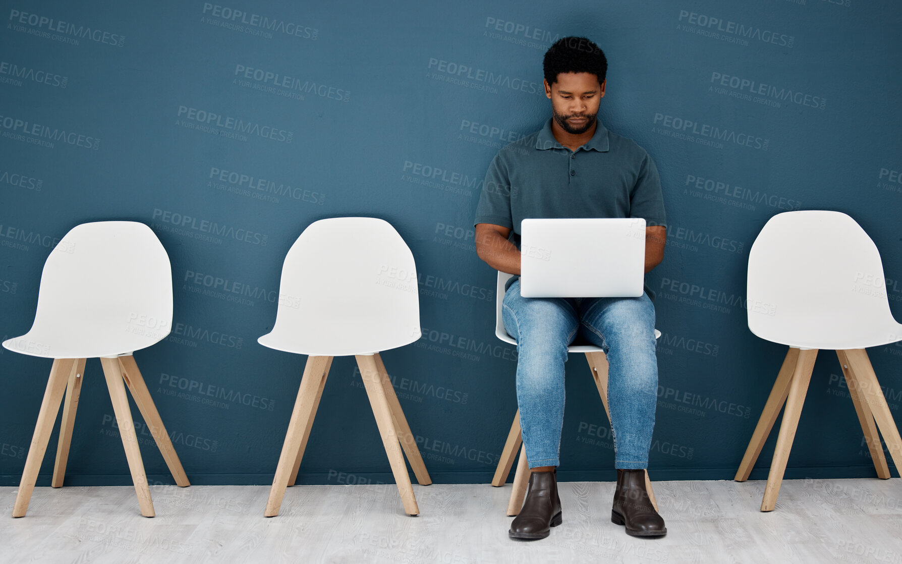 Buy stock photo Waiting room, laptop and black man for career opportunity, creative job search and application to human resources. Young male person in queue with computer for online research, recruitment or website