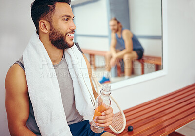 Buy stock photo Happy friends relaxing after a match. Mixed race player drinking water after a match with his friend. Two friends talking after a squash match. Coach talking to his player in the locker room