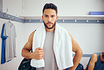 All you need is a towel for a squash match. Young mixed race player in his gym locker room. Serious player ready for a match of squash.Portrait of a player standing in his locker room