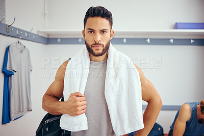 Buy stock photo All you need is a towel for a squash match. Young mixed race player in his gym locker room. Serious player ready for a match of squash.Portrait of a player standing in his locker room