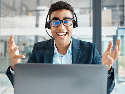 Buy stock photo Young happy mixed race businessman looking shocked while working on a laptop alone at work. One hispanic businessperson looking surprised working at a desk in an office