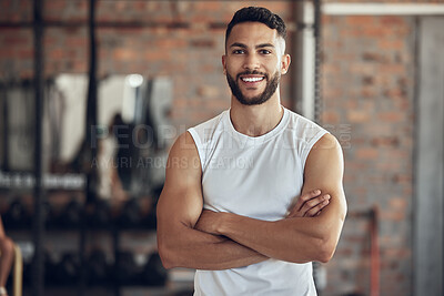 Buy stock photo Portrait of a fit man arms crossed in the gym. Proud, muscular bodybuilder in the gym. Confident, strong bodybuilder standing in the gym. Young athlete taking a break from his exercise routine