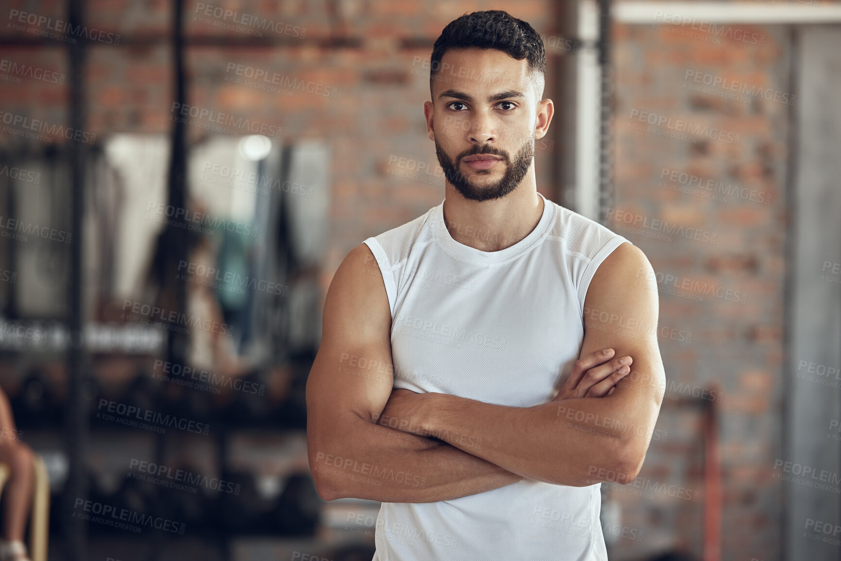 Buy stock photo Portrait of bodybuilder with attitude in the gym. Young bodybuilder with arms crossed in the gym. Cool, fit man standing in the gym. Healthy athlete taking a break from training in the gym