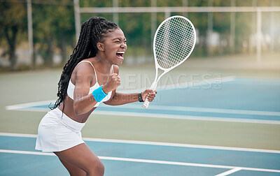 Buy stock photo Professional tennis player screaming in excitement after a match. African american woman cheering her success after a game of tennis. Excited tennis player shouting on the court after a match
