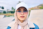 Beautiful young arab woman posing outdoors in a headscarf. Attractive female muslim wearing a hijab posing outside. She's all about style and fashion. Mixed race woman looking confident and trendy