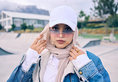 Buy stock photo Beautiful young arab woman posing outdoors in a headscarf. Attractive female muslim wearing a hijab posing outside. She's all about style and fashion. Mixed race woman looking confident and trendy