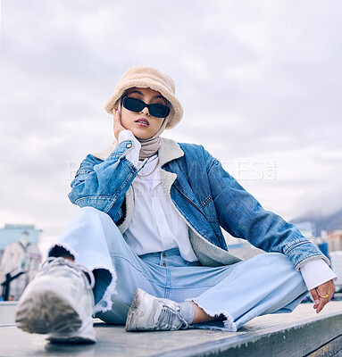 Buy stock photo Portrait, fashion and Islamic woman in a city, sunglasses and trendy with a hijab, stylish outfit or gen z. Face, Muslim female person or confident girl outdoor with casual clothes, beauty or eyewear