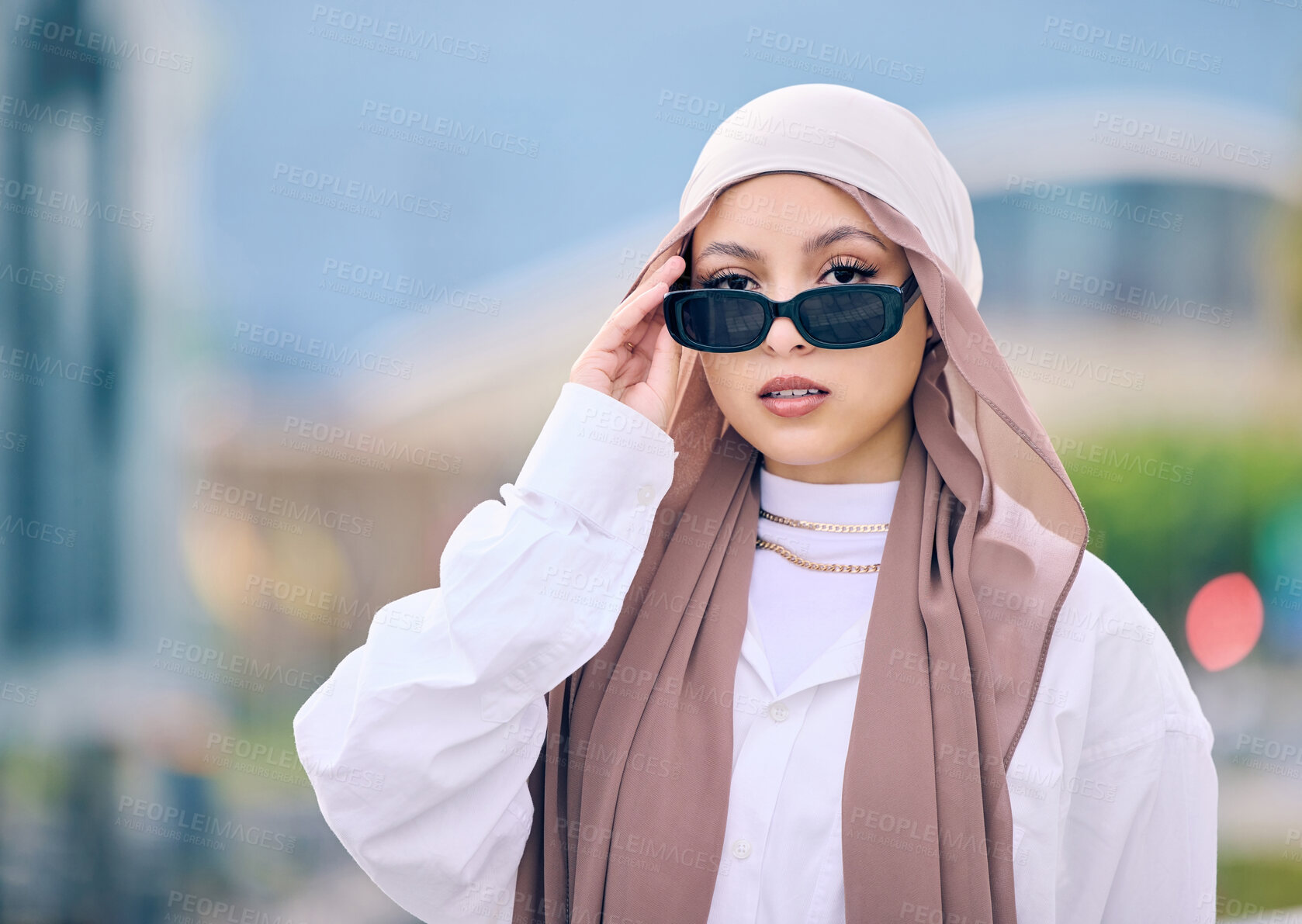 Buy stock photo Portrait, fashion or sunglasses with a muslim woman in saudi arabia wearing a cap and scarf for contemporary style. Islam, faith and hijab with a trendy young arab person posing outside in shades