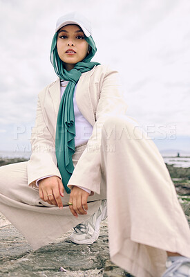 Buy stock photo Portrait, fashion or religion with a muslim woman outdoor in a cap and scarf for contemporary style. Islam, faith and hijab with a trendy young arab female person posing outside in modern clothes