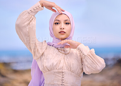 Buy stock photo Portrait, fashion or faith with a saudi woman outdoor in a scarf for religion or contemporary style. Islam, face or hijab with a trendy young muslim person posing outside in nature for modern clothes