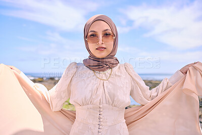 Buy stock photo Portrait, fashion or religion with an arab woman outdoor in sunglasses and a scarf for contemporary style. Muslim, faith and dress with a trendy young islamic person posing outside in modern clothes