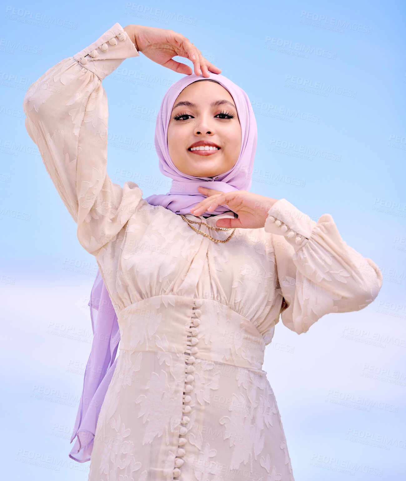 Buy stock photo Portrait, fashion or religion with a happy saudi woman on a blue sky background in a scarf for style. Islam, faith or hijab with a trendy young muslim person posing outdoor in contemporary clothes