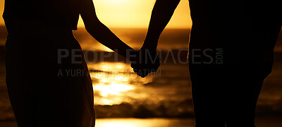 Buy stock photo Silhouette, couple and holding hands at sunset on beach for vacation or holiday outdoor. Behind man and woman in nature with creative art, space and ocean for love, shadow and travel or freedom 