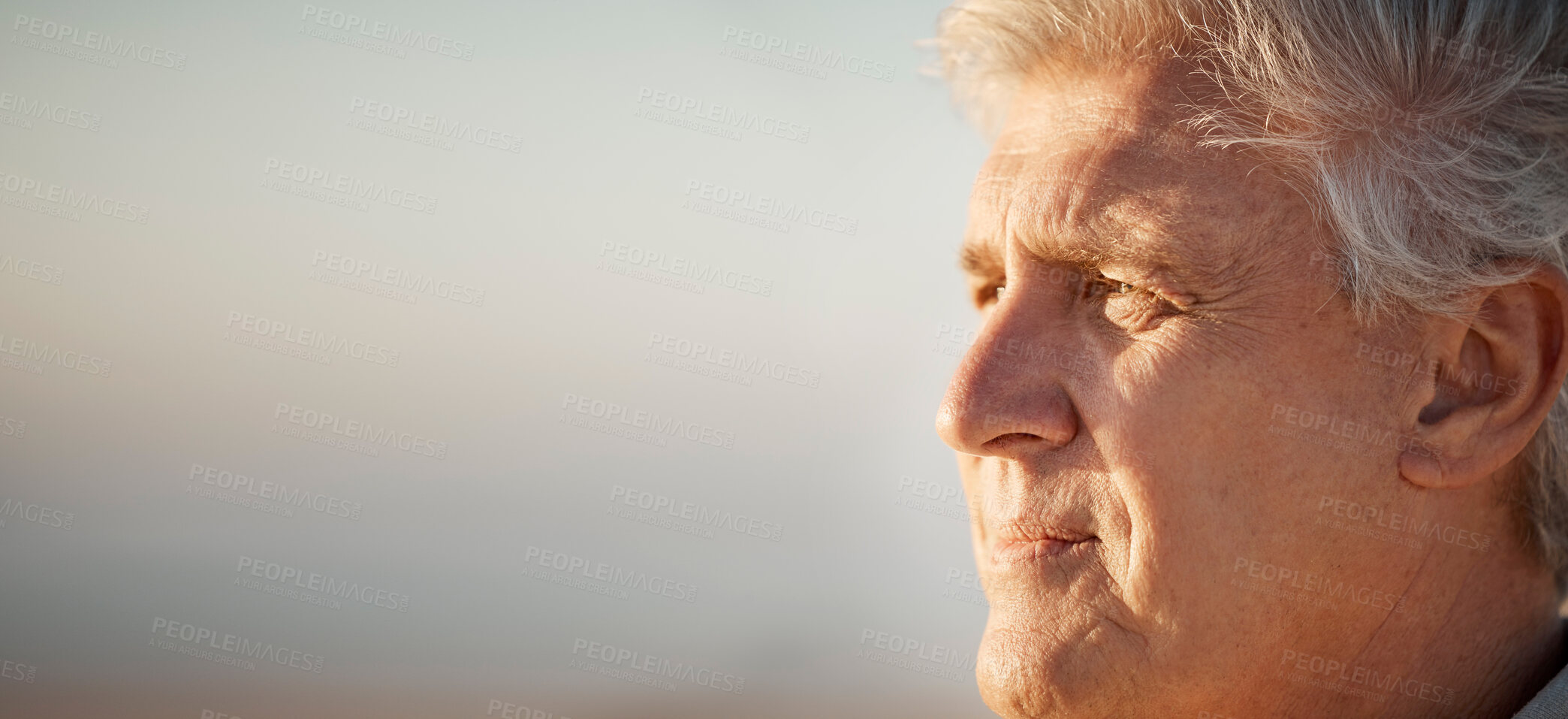 Buy stock photo Mature man enjoying the view on the beach. Senior man looking at the view on the beach. Mature man on holiday by the beach. Closeup on face of older man enjoying a holiday on the beach.