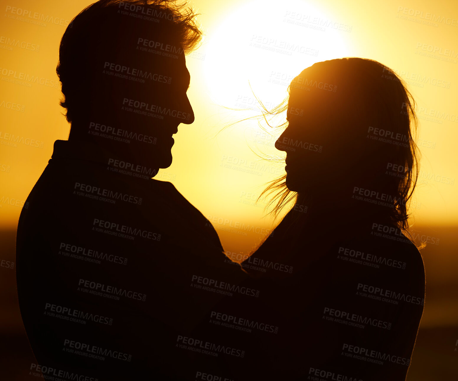 Buy stock photo Silhouette, couple and love at sunset on beach for vacation, holiday or adventure outdoor in nature. Romantic man and woman in marriage with sky background for care, shadow art and travel freedom 