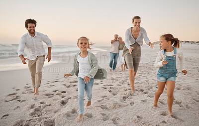Buy stock photo Love, big family walking on the beach and sunset with parents playing with their children. Carefree or freedom, holiday break or summer vacation and happiness with people walk on sand by the ocean 
