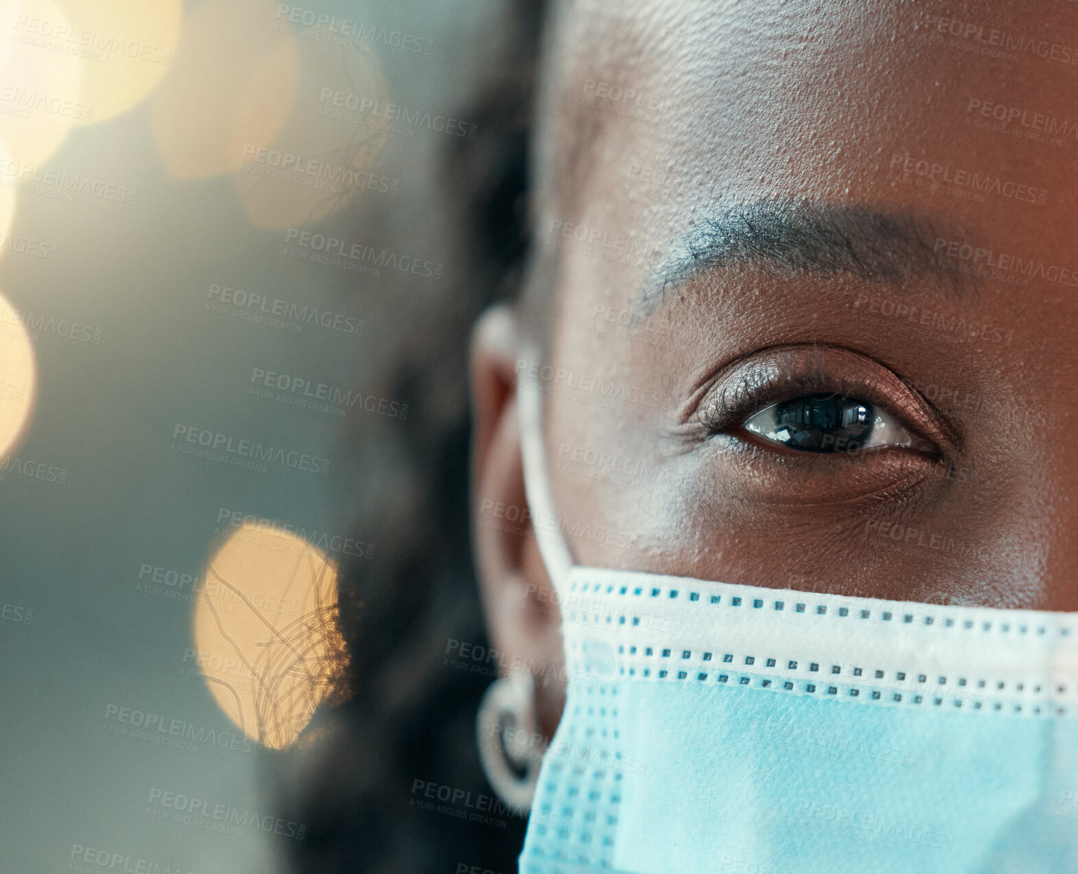 Buy stock photo Zoom, doctor and face mask for black woman, hospital and safety from bacteria, germs and night for healthcare. African medic, nurse and dark clinic with macro, eye and portrait for wellness with ppe