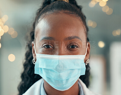 Buy stock photo Doctor, face mask and african woman, hospital and safety from bacteria, germs and night for healthcare. Black female medic, nurse and dark clinic with headshot, vision and portrait with ppe at job