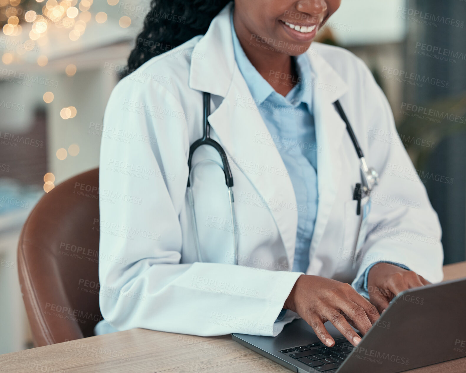 Buy stock photo Laptop, doctor and hands of woman typing for research, healthcare or telehealth in hospital. Computer, medical professional and happy person with online consultation, reading email and wellness