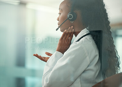 Medical call center rep with a sore throat.customer service agent touching her neck in pain. Medical doctor on a telehealth call with a patient. African American doctor working in a call center