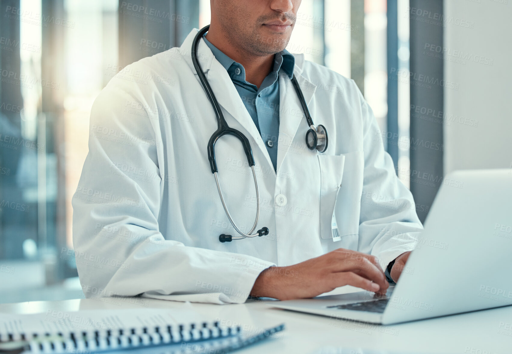 Buy stock photo Laptop, doctor hands and man typing for research, healthcare or telehealth in wellness hospital. Computer, medical professional or person with email, online consultation or writing health information