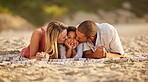 Portrait of a happy mixed race family spending time together on the beach. Adorable little girl enjoying vacation with her mother and father