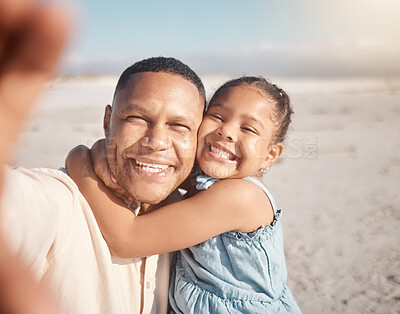 Smiling mixed race single father taking selfie with little affectionate daughter on beach. Adorable, happy, hispanic girl bonding and hugging parent. Man and child enjoying free time together outside