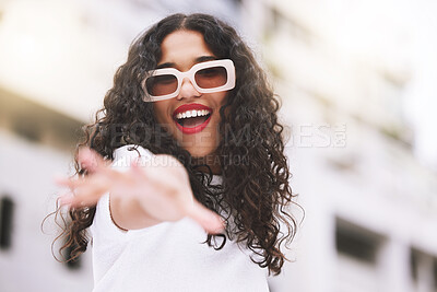 Buy stock photo Designer sunglasses, luxury clothes and model being creative against city background, smile for summer and happy on weekend in town. Portrait of cool and trendy girl posing in fashion downtown