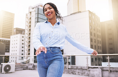 Beautiful mixed race fashion woman walking outside in the city during the day. Young hispanic woman looking stylish and trendy, smiling and happy while outdoors in summer. Carefree and fashionable