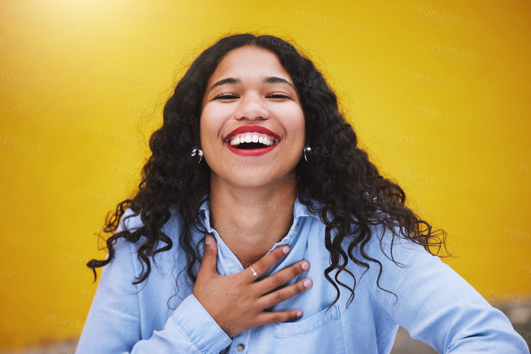 Buy stock photo Happy, smile and fun with a woman laughing and joking in studio against a yellow background. Carefree, joy and humor with an attractive young female standing inside on a bright and colorful wall