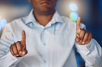Buy stock photo Closeup hands of african man using touchscreen technology. African american business man using wireless innovation while working late night in office. Putting in overtime after hours to ensure success