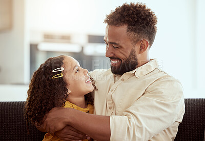 Buy stock photo Mixed race single father and daughter hugging in home living room. Smiling hispanic girl embracing and bonding with single parent in lounge. Happy affectionate man and child together on weekend