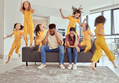 Buy stock photo Stressed mixed race parents and adhd daughter in living room at home. Hyperactive hispanic girl running and jumping around lounge. Mother and father sitting together with headache and feeling anxious