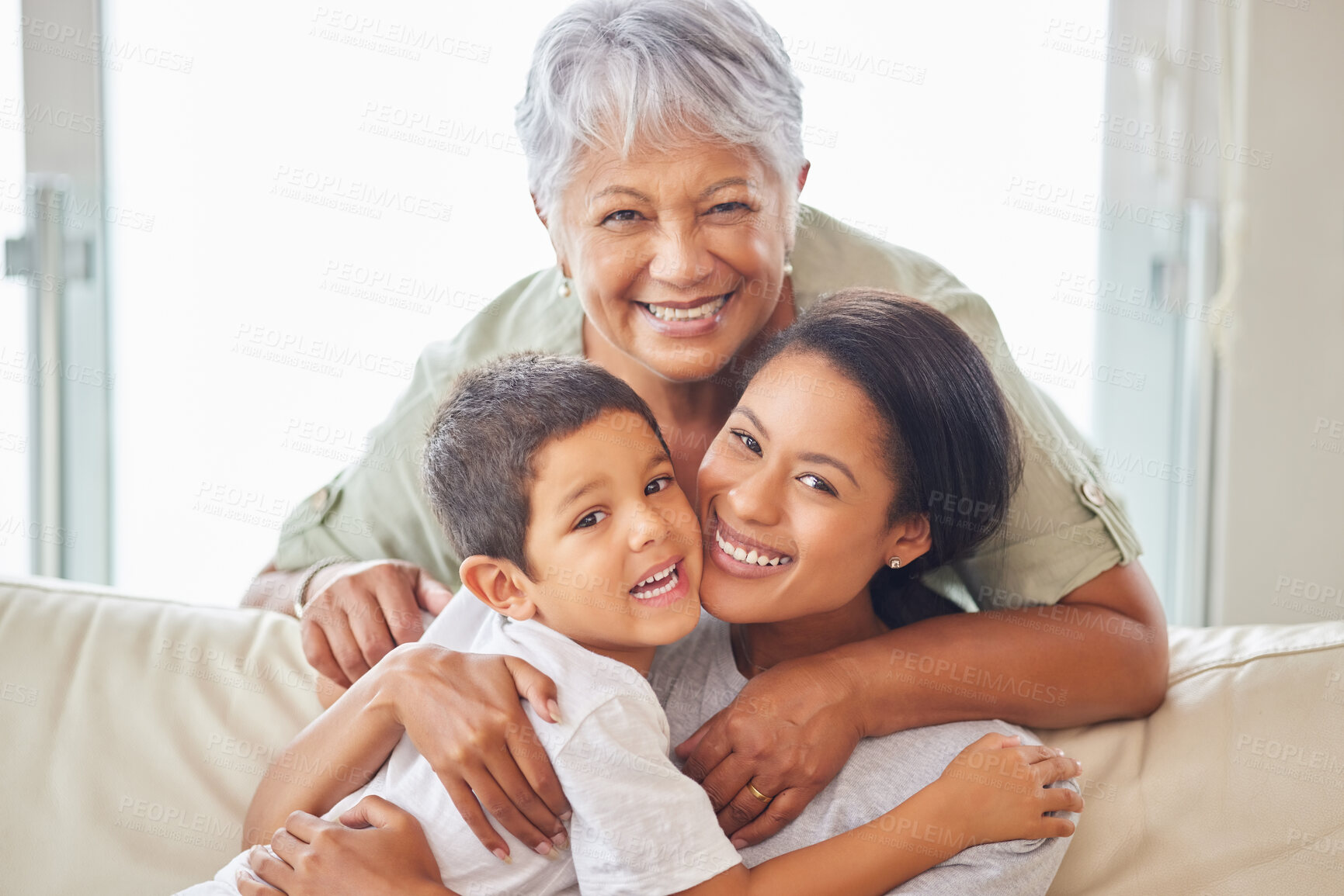 Buy stock photo Happy mature grandmother relaxing with her grandson and adult daughter at home. Cheerful little hispanic boy sitting on the couch together with his mother and grandmother