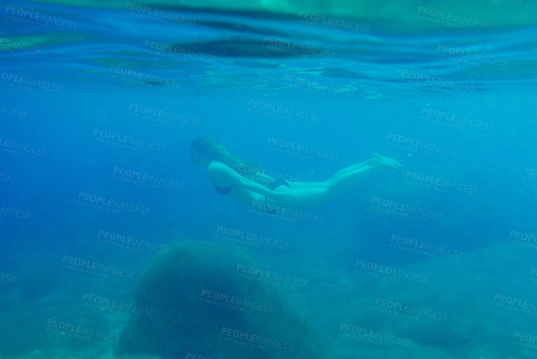 Buy stock photo Woman, swimming and sea or travel underwater for adventure, nature explore on summer vacation. Female person, ocean island and discover journey on tropical holiday, exotic diving on paradise trip