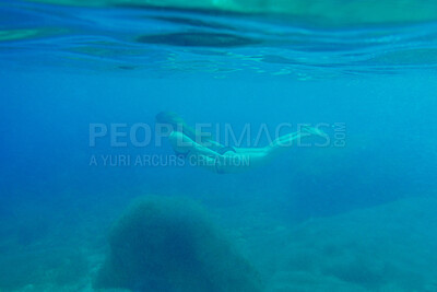 Buy stock photo Woman, swimming and sea or travel underwater for adventure, nature explore on summer vacation. Female person, ocean island and discover journey on tropical holiday, exotic diving on paradise trip