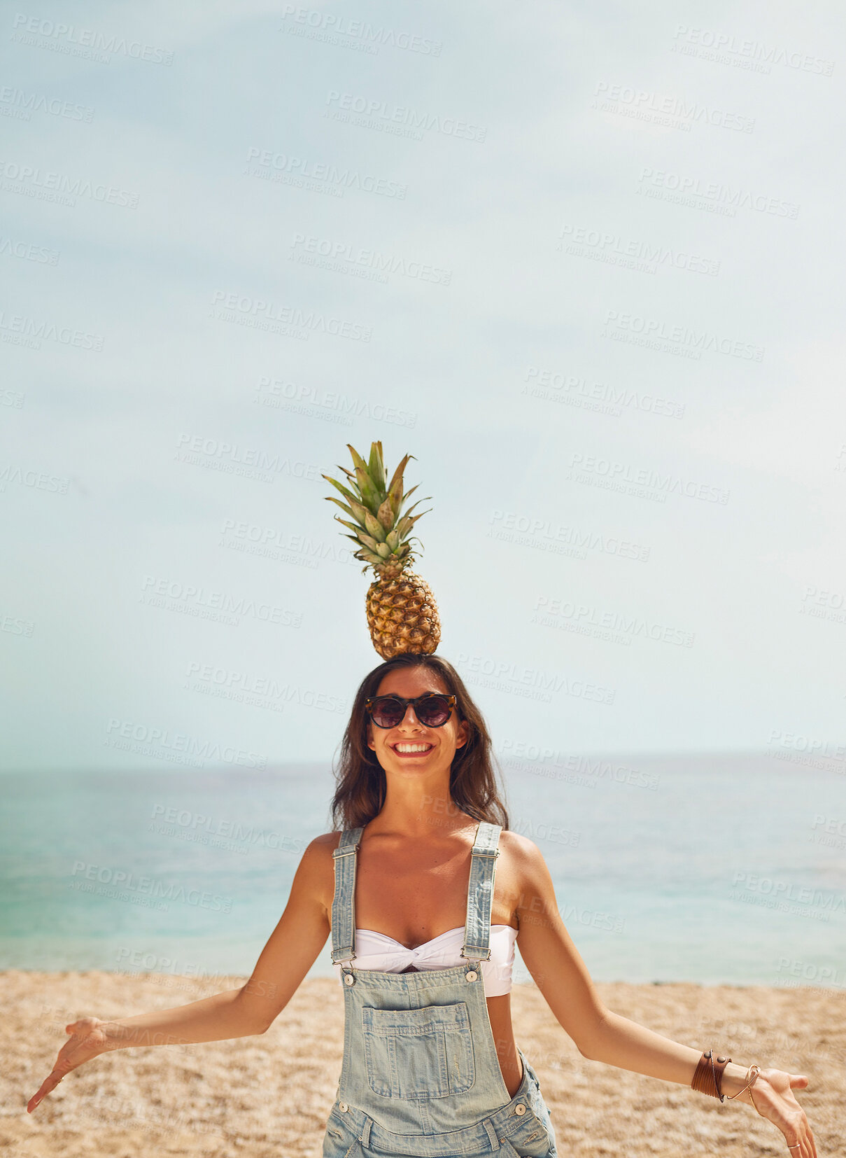 Buy stock photo Beach, smile and woman with pineapple on head for comic, funny or silly joke on holiday or adventure. Travel, happy and goofy female person with fruit by the ocean or sea on vacation or weekend trip.