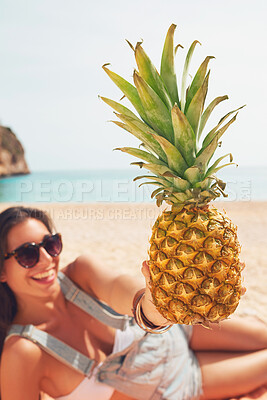 Buy stock photo Pineapple, travel and portrait of a woman on the beach to relax on holiday or vacation during summer. Relax, smile and a happy young person with fruit on the sand by the ocean or sand for tourism