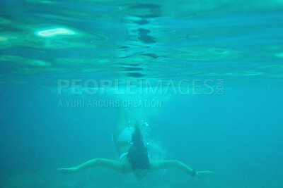 Buy stock photo Beautiful woman swimming underwater on paradise beach freedom wellbeing lifestyle summer vacation wanderlust