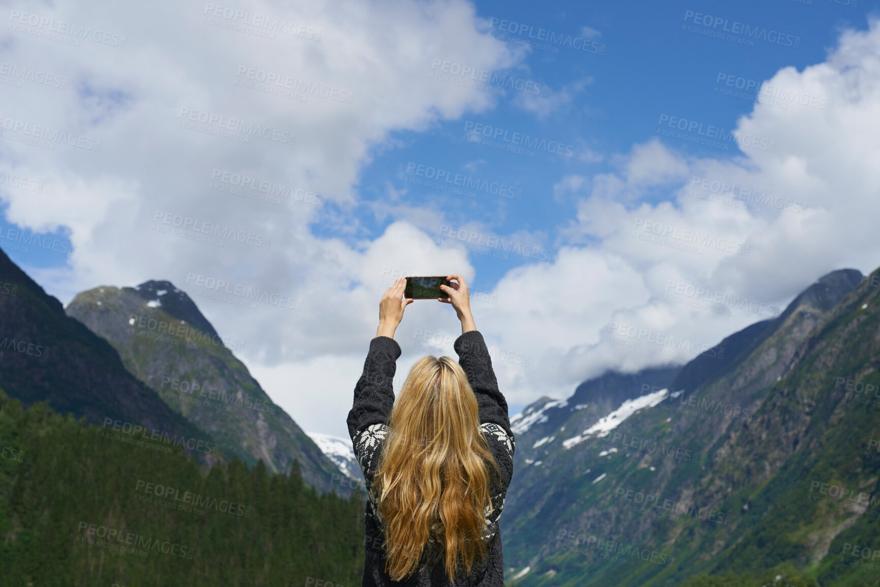 Buy stock photo Adventure woman taking photo smart phone of glacial valley landscape on travel exploration for social media