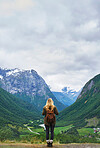 Travel adventure woman enjoying view of majestic glacial valley on exploration discover beautiful earth